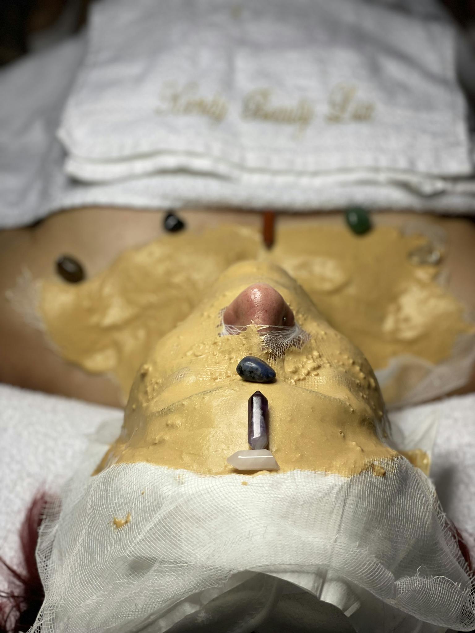 A rejuvenating spa facial with gemstone therapy for skin and mind relaxation.