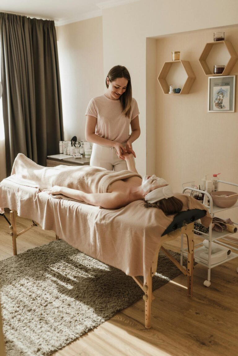 A serene spa setting with a woman receiving a relaxing massage session for ultimate wellness. luxury mobile spa Cape Town spa treatments at home Cape Town